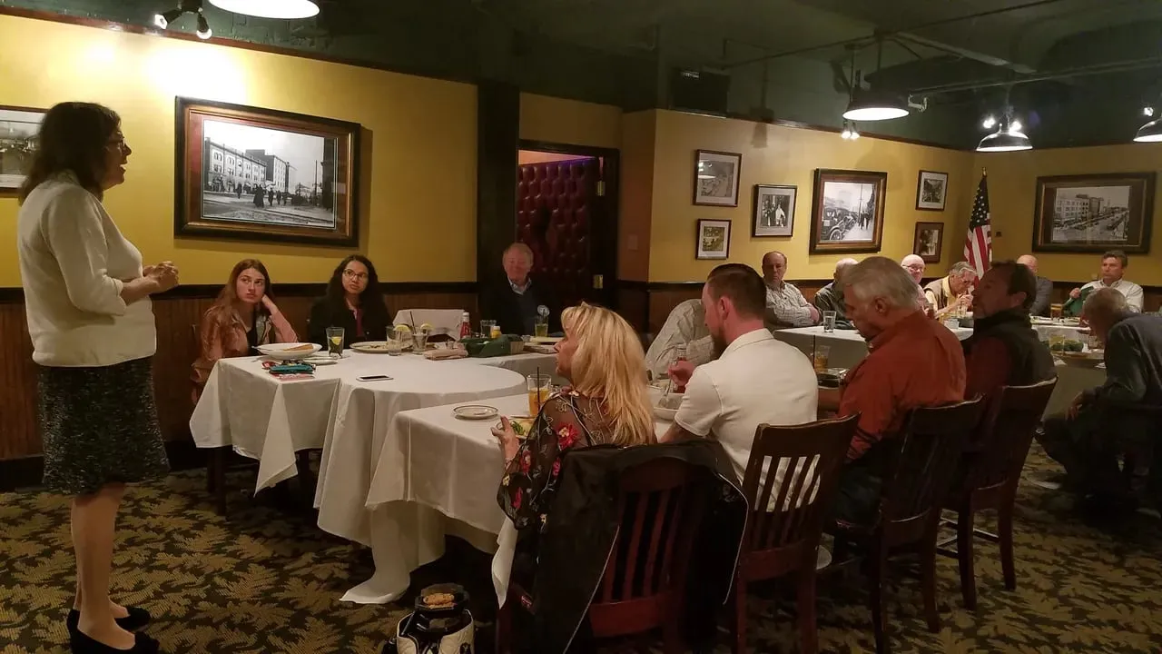 A guest speaker addressing members over lunch